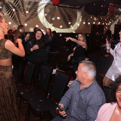 a group of people standing in front of a crowd posing for the camera